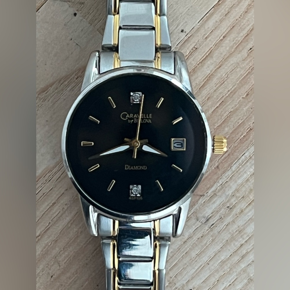 Caravelle by Bulova Ladies Watch Diamonds Black Dial Two Tone Bracelet